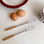 mini whisk with wooden handle for effortless mixing and blending