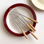 mini whisk with wooden handle for effortless mixing and blending