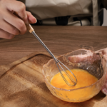 mini whisk with wooden handle for effortless mixing and blending