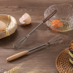 mini whisk with wooden handle for effortless mixing and blending